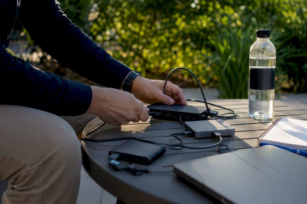Hands setting up technical demo equipment