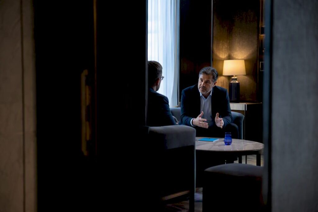 Recruiter holding confidential executive search conversation